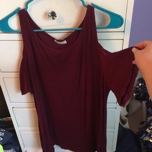 A short maroon dress with cutout sleeves